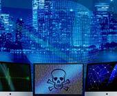 PC-Bildschirme mit Totenkopf vor Skyline